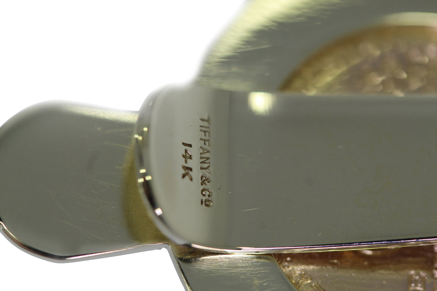 Goldmünze in Geldscheinklammer von Tiffany