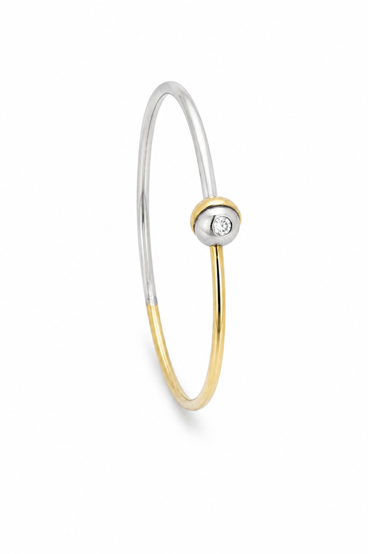 Armreif aus 750/- Gelbgold und 950/- Platin mit Brillant